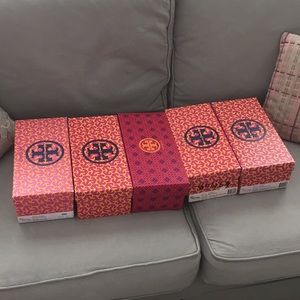 Four (one sold) Tory Burch shoe boxes.